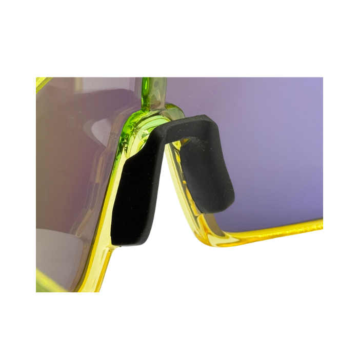Close-up of a pair of sunglasses with a yellow frame and black nose pad on a white background
