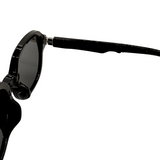 Hinges of foldable, round-framed Black Colour sunglasses and uv protected lenses.