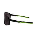 Side Vew of black Hokky Rush sunglasses with green accents and mirrored black lenses designed for cycling or skiing.