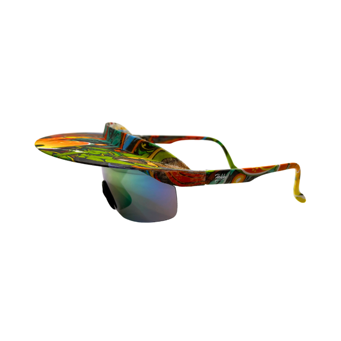 A pair of 'Tidal' 2 in 1 visor sunglasses with a multicolored frame and graffiti polarized lenses.