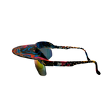 Side View of 'Tidal' 2 in 1 visor sunglasses with a multicolored frame and blue polarized lenses.