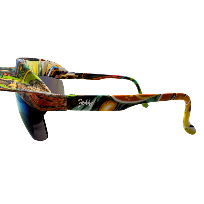 Side View of 'Tidal' 2 in 1 visor sunglasses with a multicolored frame and graffiti polarized lenses.