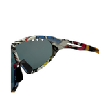 Sunglasses with a Vivid colour and Cryo Hinge patterned frame on a white background