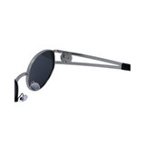 Hinges of 'Regina' women's sunglasses with a silver metal frame and blue polarized lenses.