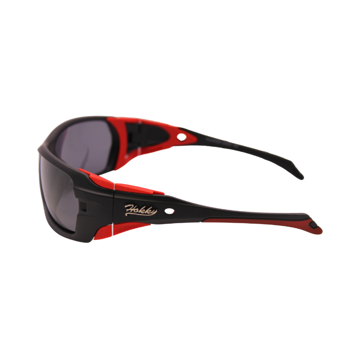 Side View of Hokky 'Edge' unisex sunglasses with black frame and red accents, and polarized grey lenses.