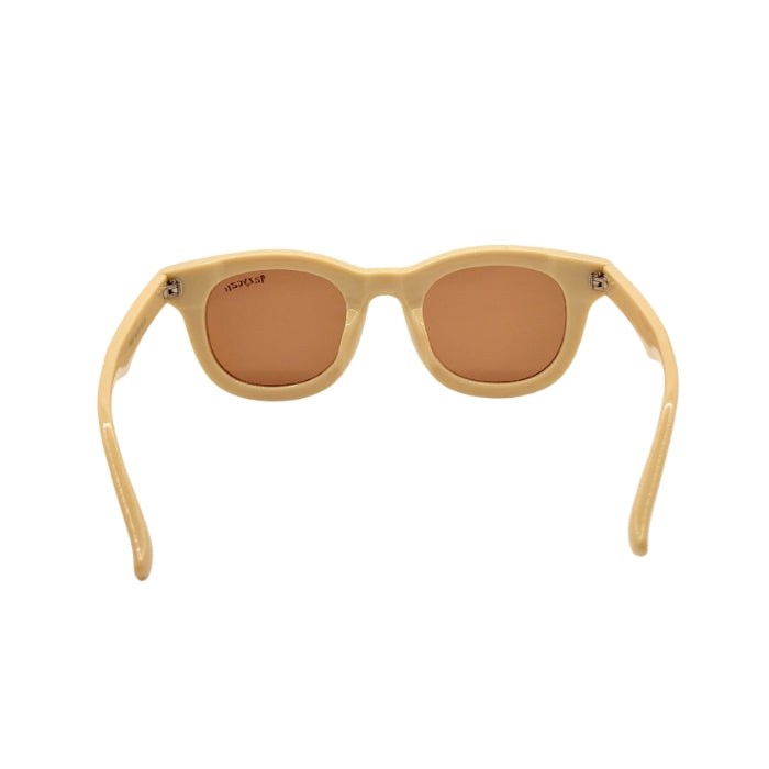 Beige sunglasses with brown lenses on a white background