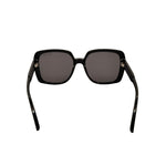 Black sunglasses with dark lenses on a white background