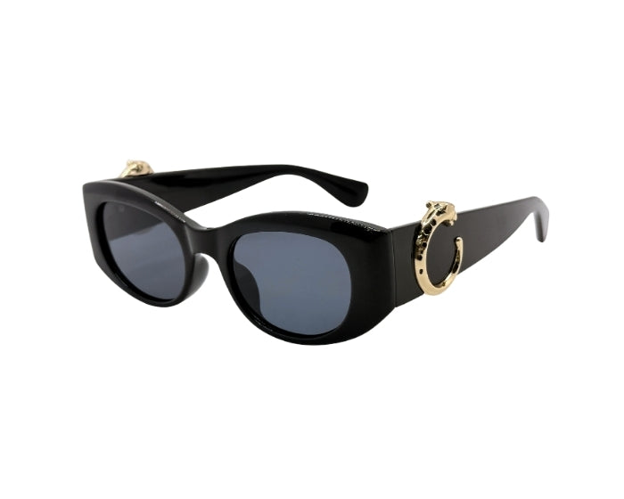 Black sunglasses with gold accents on a white background