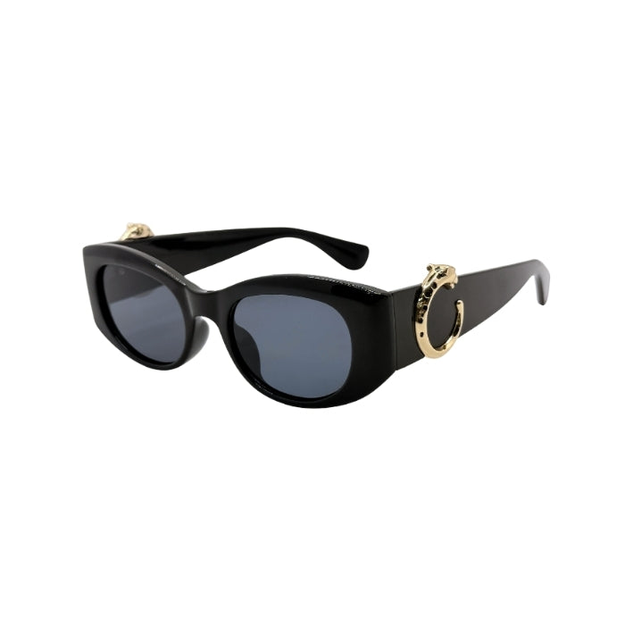 Black sunglasses with gold accents on a white background
