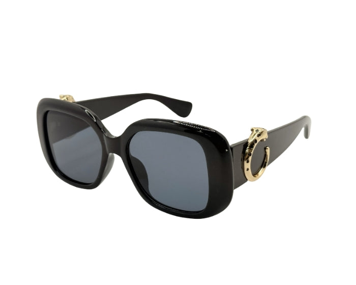 Black sunglasses with gold accents on a white background