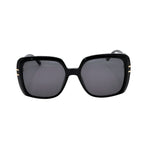 Black sunglasses with gold accents on a white background