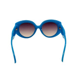 Blue sunglasses with gradient lenses on a white background