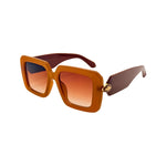 Brown sunglasses with a gradient lens on a white background