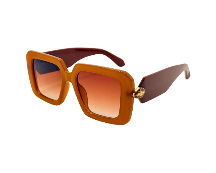Brown sunglasses with a gradient lens on a white background