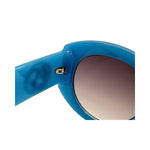Close-up of blue sunglasses with a gradient lens on a white background