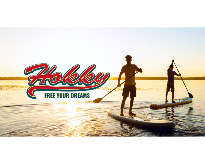 A person on a boat overlooking a scenic coastal view, promoting a gift card for sunglasses.
