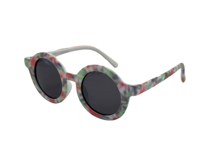 Side View of Children's round sunglasses with floral pattern on the frame, featuring polarised lenses.