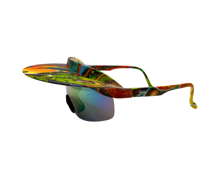A pair of 'Tidal' 2 in 1 visor sunglasses with a multicolored frame and graffiti polarized lenses.