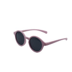 Pink sunglasses with dark lenses on a white background