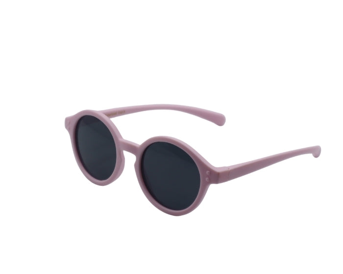 Pink sunglasses with dark lenses on a white background