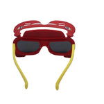 Red sunglasses with yellow headband on a white background