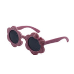 Pink sunglasses with floral design on a white background