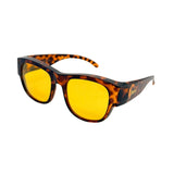 Sunglasses with tortoiseshell frame and yellow lenses on a white background