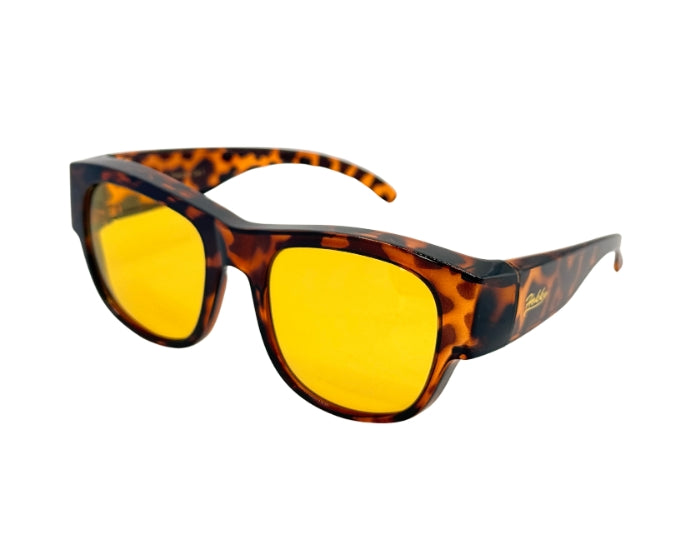 Sunglasses with tortoiseshell frame and yellow lenses on a white background