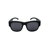 Black sunglasses with dark lenses on a white background