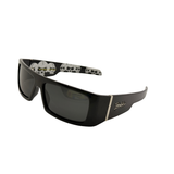 Black sunglasses with skull designs on the arms against a white background