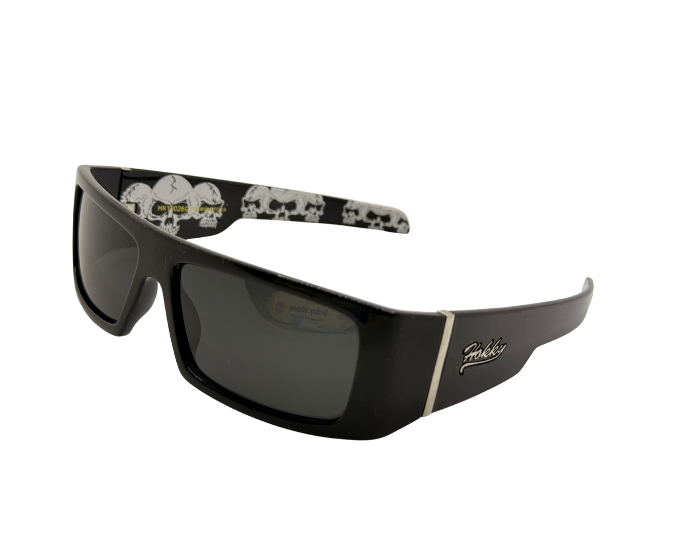 Black sunglasses with skull designs on the arms against a white background