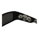 Black sunglasses with skull designs on the arm on a white background
