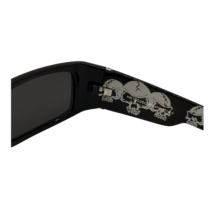 Black sunglasses with skull designs on the arm on a white background