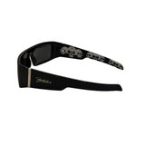 Black sunglasses with skull design on arms on a white background