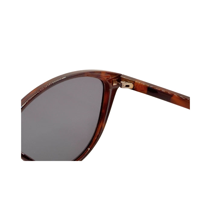 Sunglasses with tortoiseshell frame and dark lenses on a white background