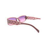 Pink sunglasses with a white lattice pattern on the frame against a white background