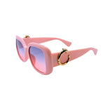 Pink sunglasses with gold accents on a white background