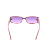 Pink sunglasses with purple lenses on a white background