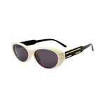 Sunglasses with a cream frame and black lenses on a white background