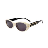 Sunglasses with a cream frame and black lenses on a white background