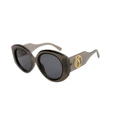 Sunglasses with a gold logo on a white background