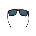 Sunglasses with brown frame and dark lenses on a white background