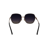 Sunglasses with dark lenses and gold frames on a white background