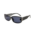 Sunglasses with decorative frame on a white background
