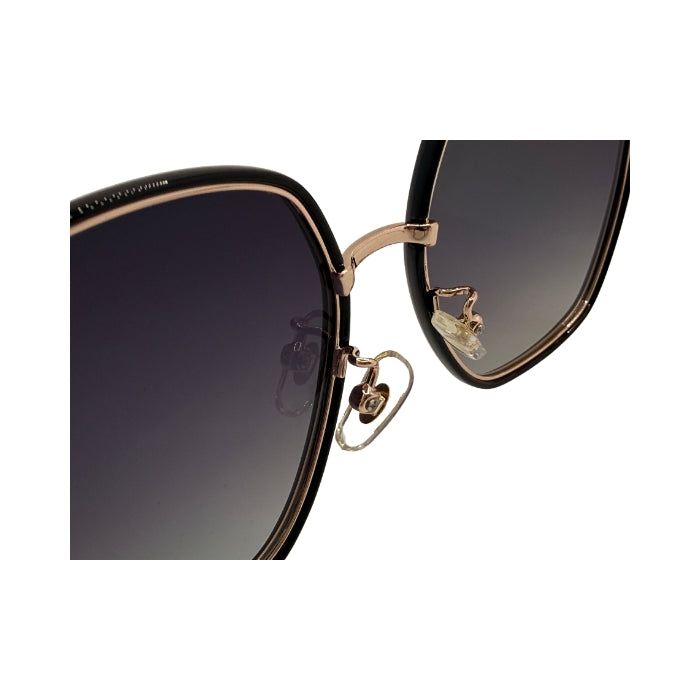 Sunglasses with gold frame and black gradient lenses on a white background