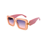 Sunglasses with pink frame and gradient lenses on a white background