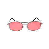 Sunglasses with pink lenses and thin metal frame on a white background