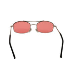 Sunglasses with pink lenses and black frames on a white background