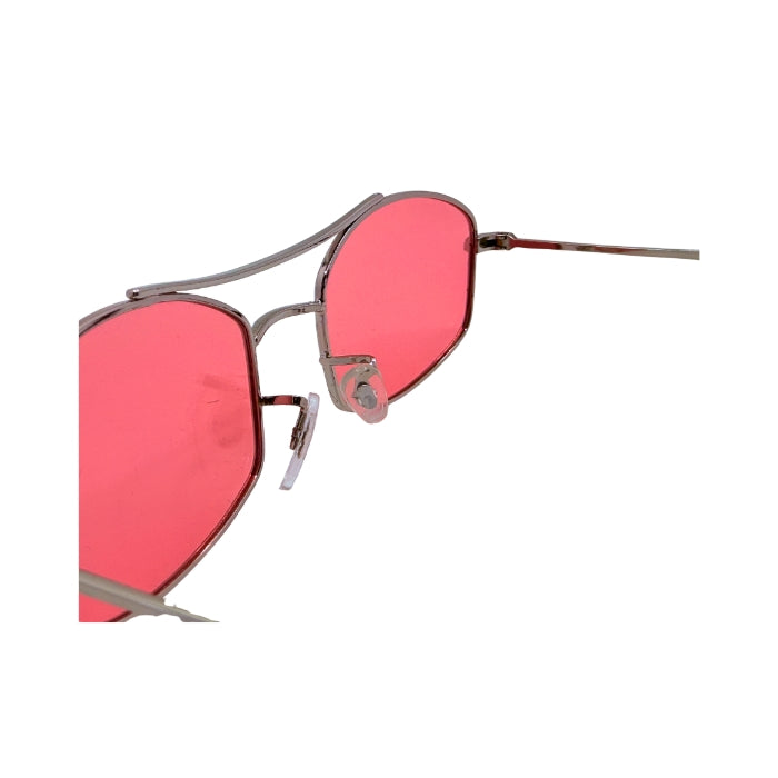Sunglasses with pink lenses and thin metal frame on a white background