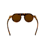 Sunglasses with tortoiseshell frame and brown lenses on a white background